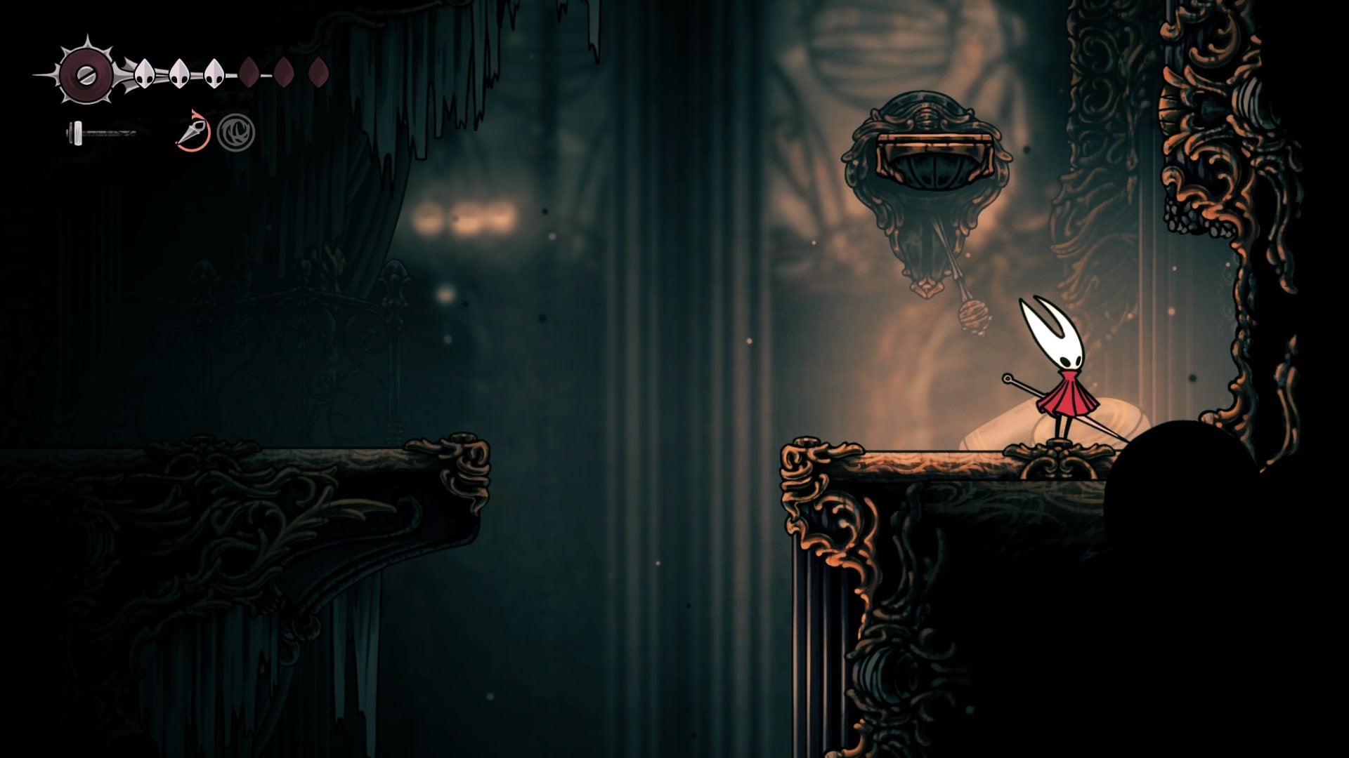 Hornet stands beside a breakable wall in Choral Chambers in Hollow Knight: Silksong