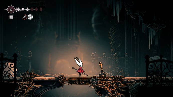 Hornet stands beside a lever in Choral Chambers in Hollow Knight: Silksong