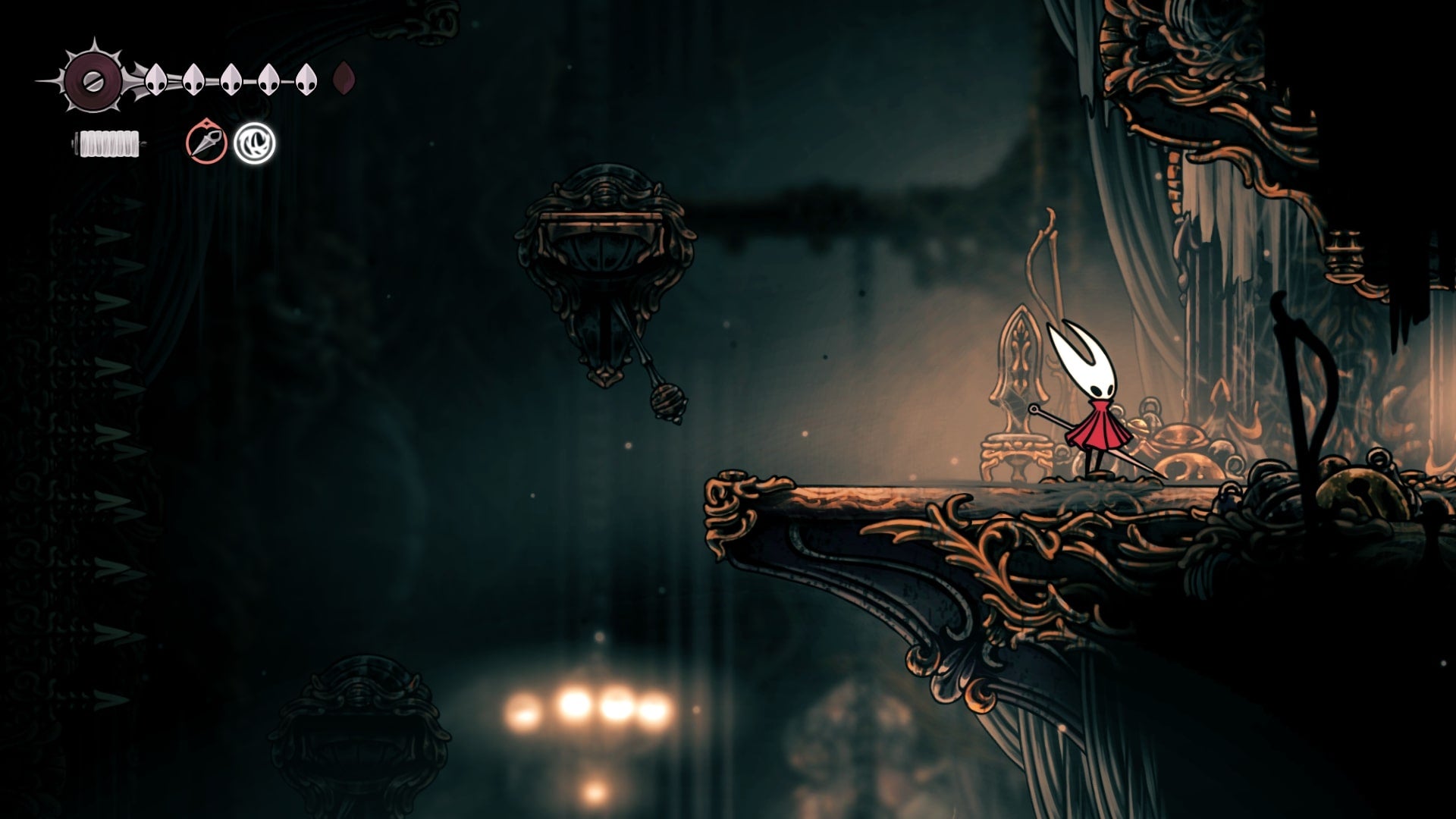 Hornet stands beside a hidden passage in Choral Chambers in Hollow Knight: Silksong