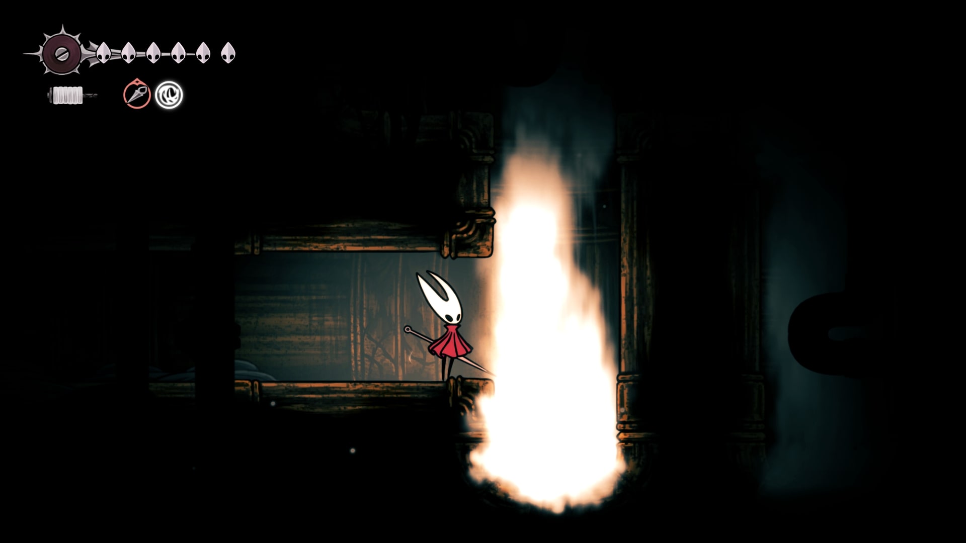 Hornet stands beside a chamber that is having steam blasted into it in Choral Chambers in Hollow Knight: Silksong