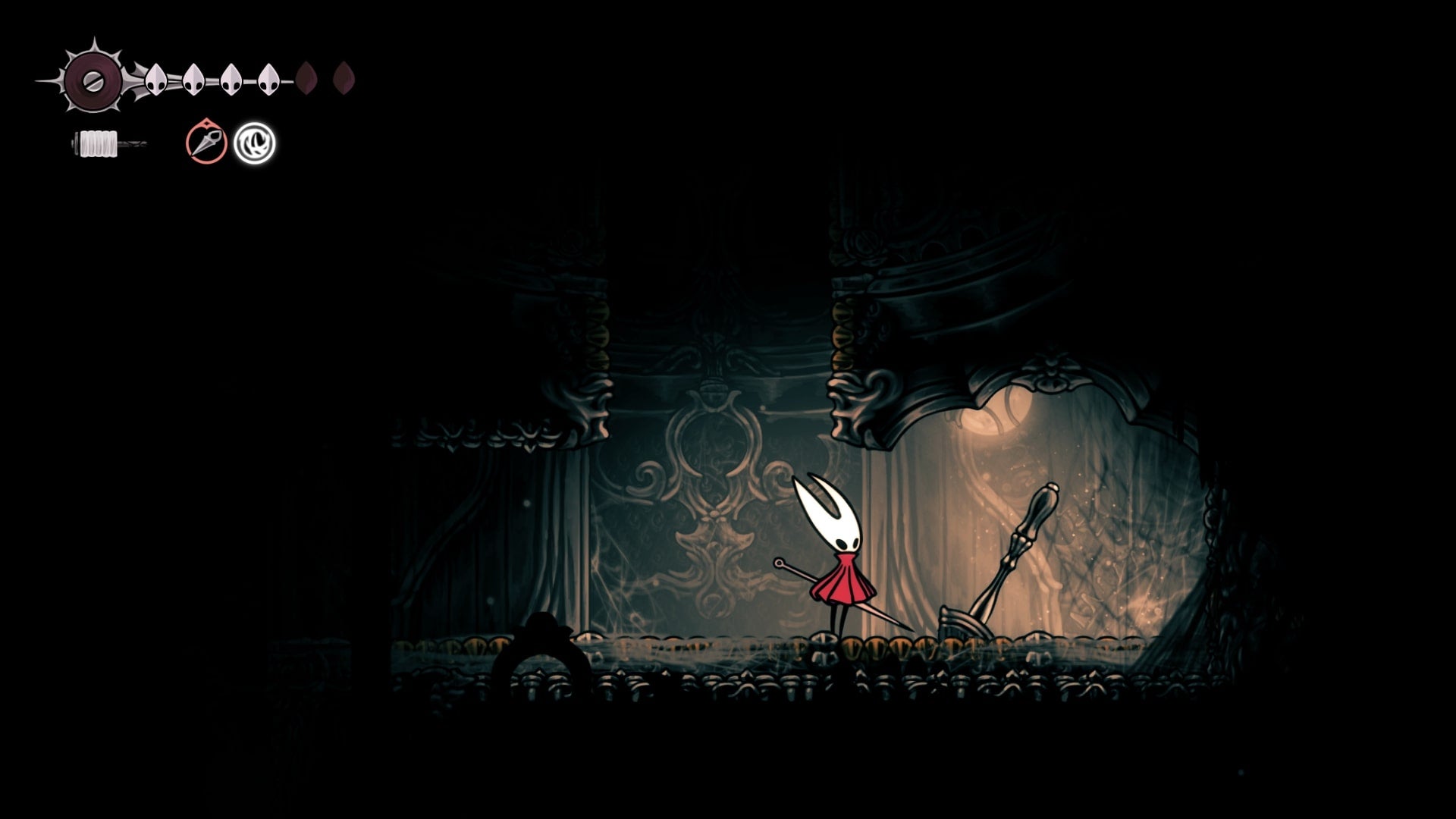 Hornet stands beside a lever in Choral Chambers in Hollow Knight: Silksong