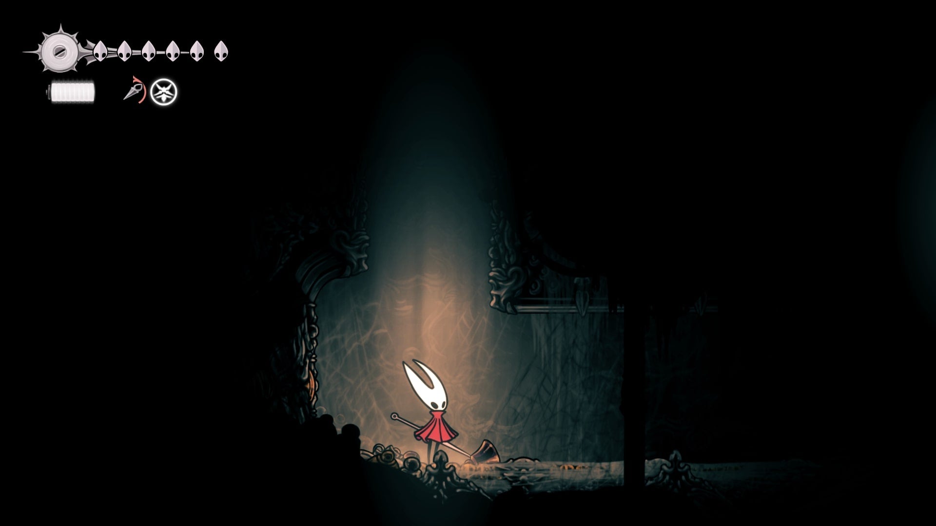 Hornet stands below a vertical passage in Choral Chambers in Hollow Knight: Silksong