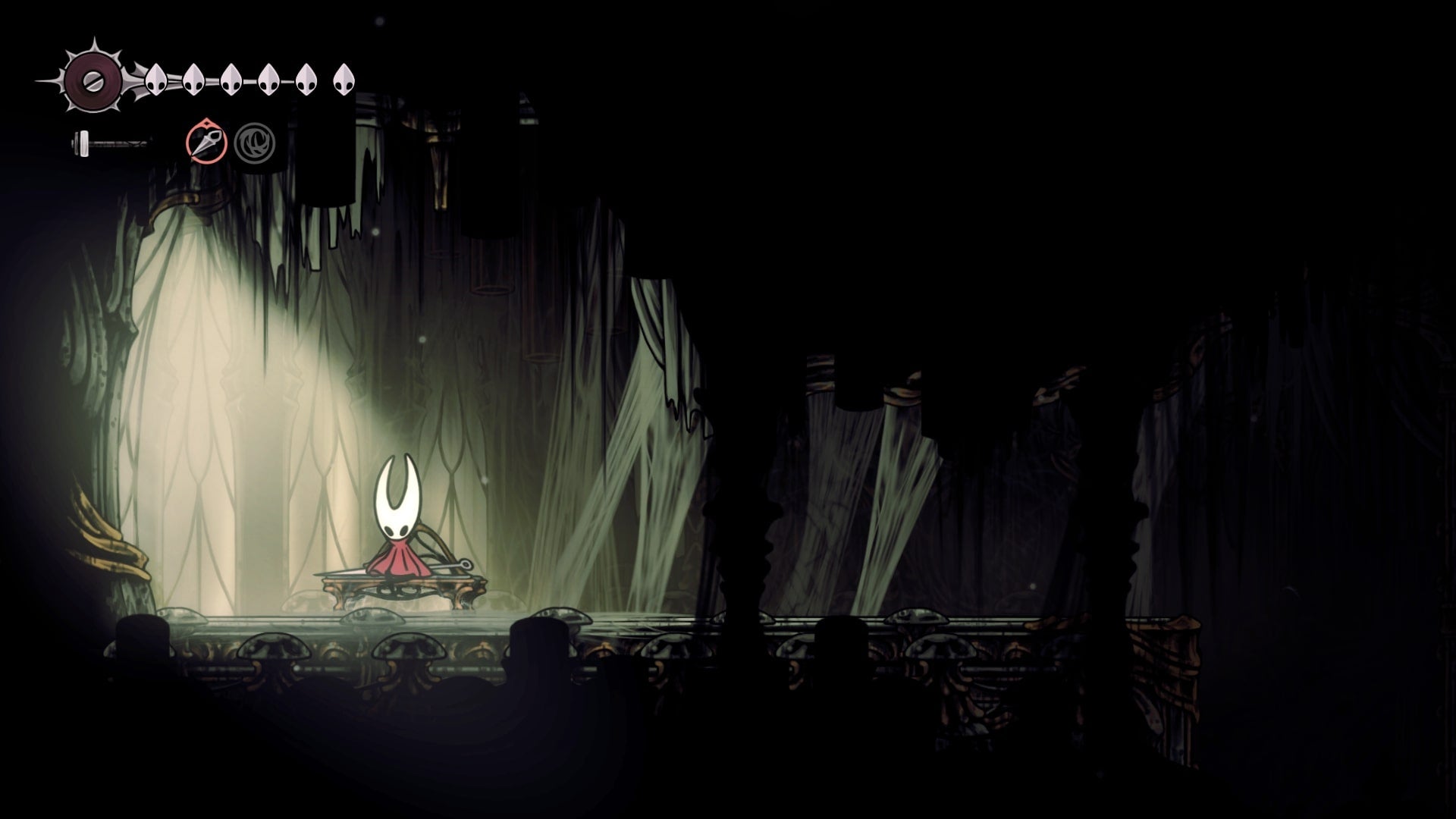 Hornet rests at the Exhaust Organ Bench in Hollow Knight: Silksong