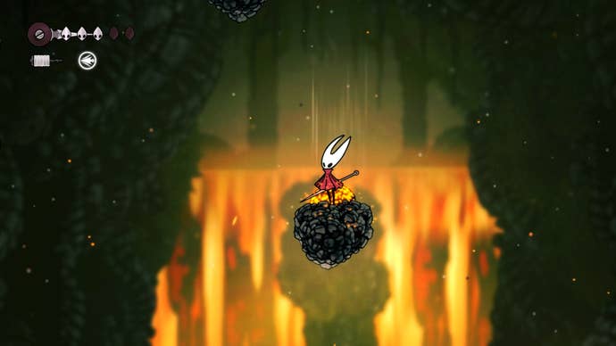 Hornet stands on a platform with a molten rock blocking an updraft on it in Hollow Knight: Silksong