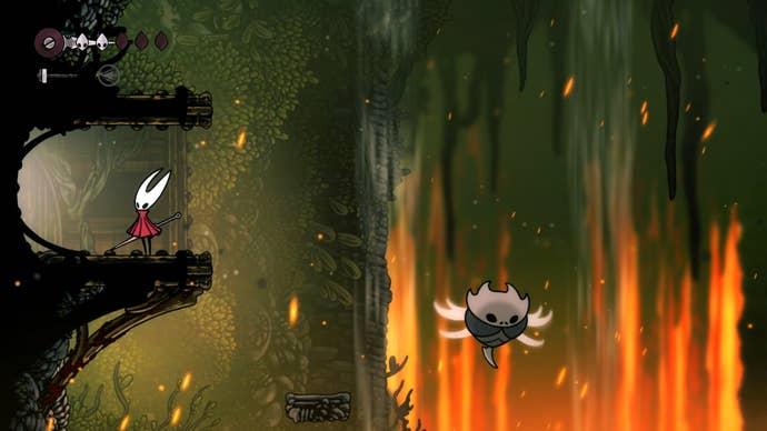 Hornet stands on a ledge leading to the Warding Bell area in Far Fields in Hollow Knight: Silksong