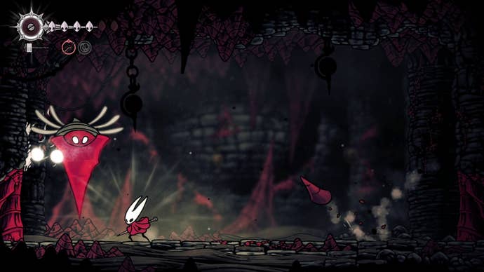 Hornet prepares to attack one of the Great Conchflies as they drill into the ground in Hollow Knight: Silksong