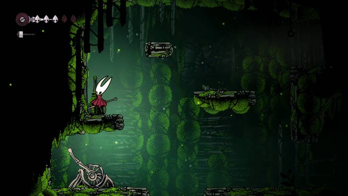 Hornet stands on a ledge above a lever in Mosshome in Hollow Knight: Silksong