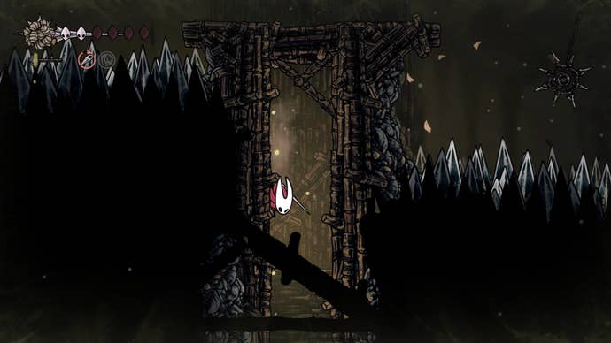 Hornet climbs a wall blocked by a wooden blockade in Sinner's Road in Hollow Knight: Silksong