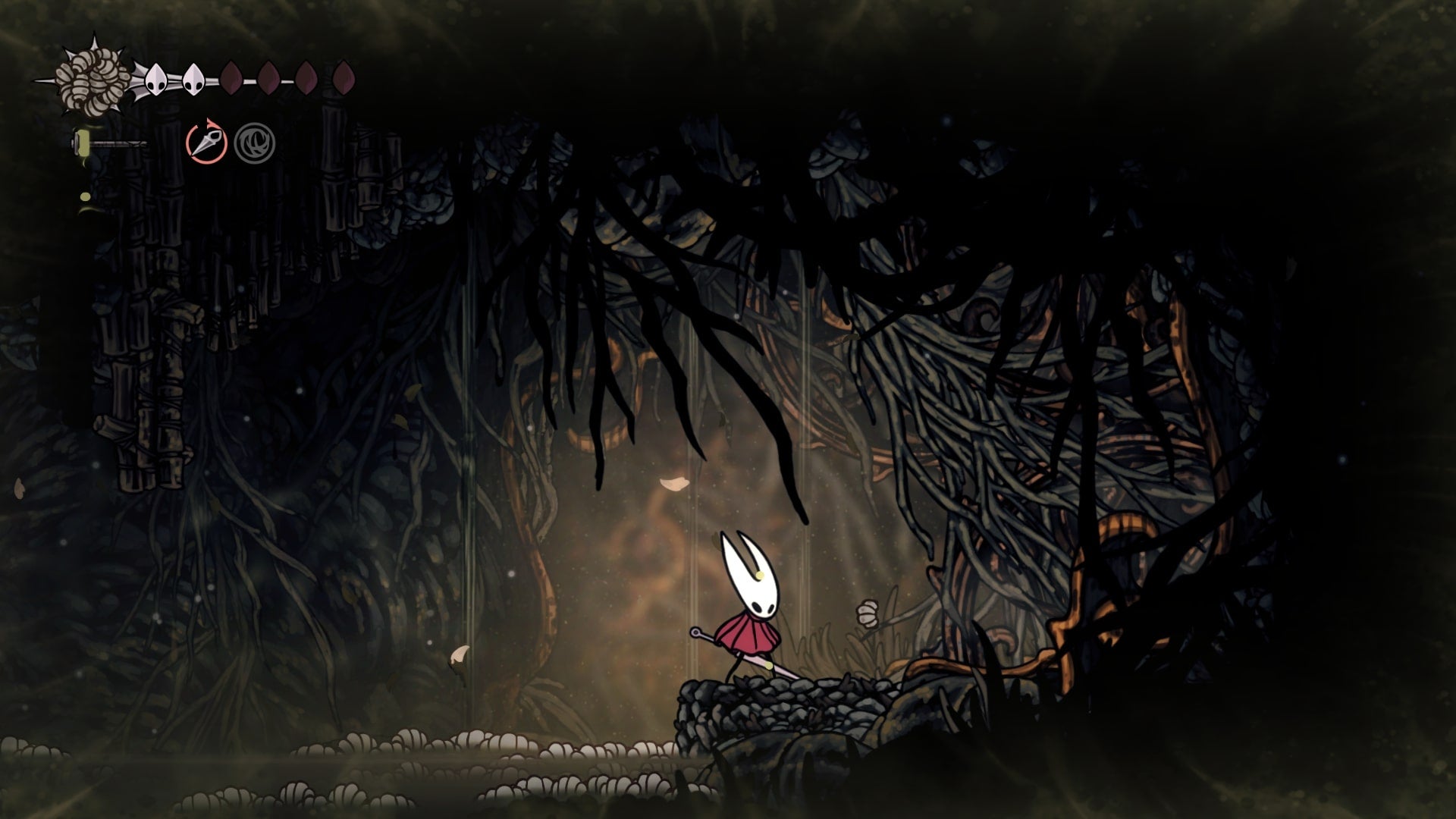 Hornet stands beside some tree branches - which are blocking cogs that power the nearby Bench - in Sinner's Road in Hollow Knight: Silksong