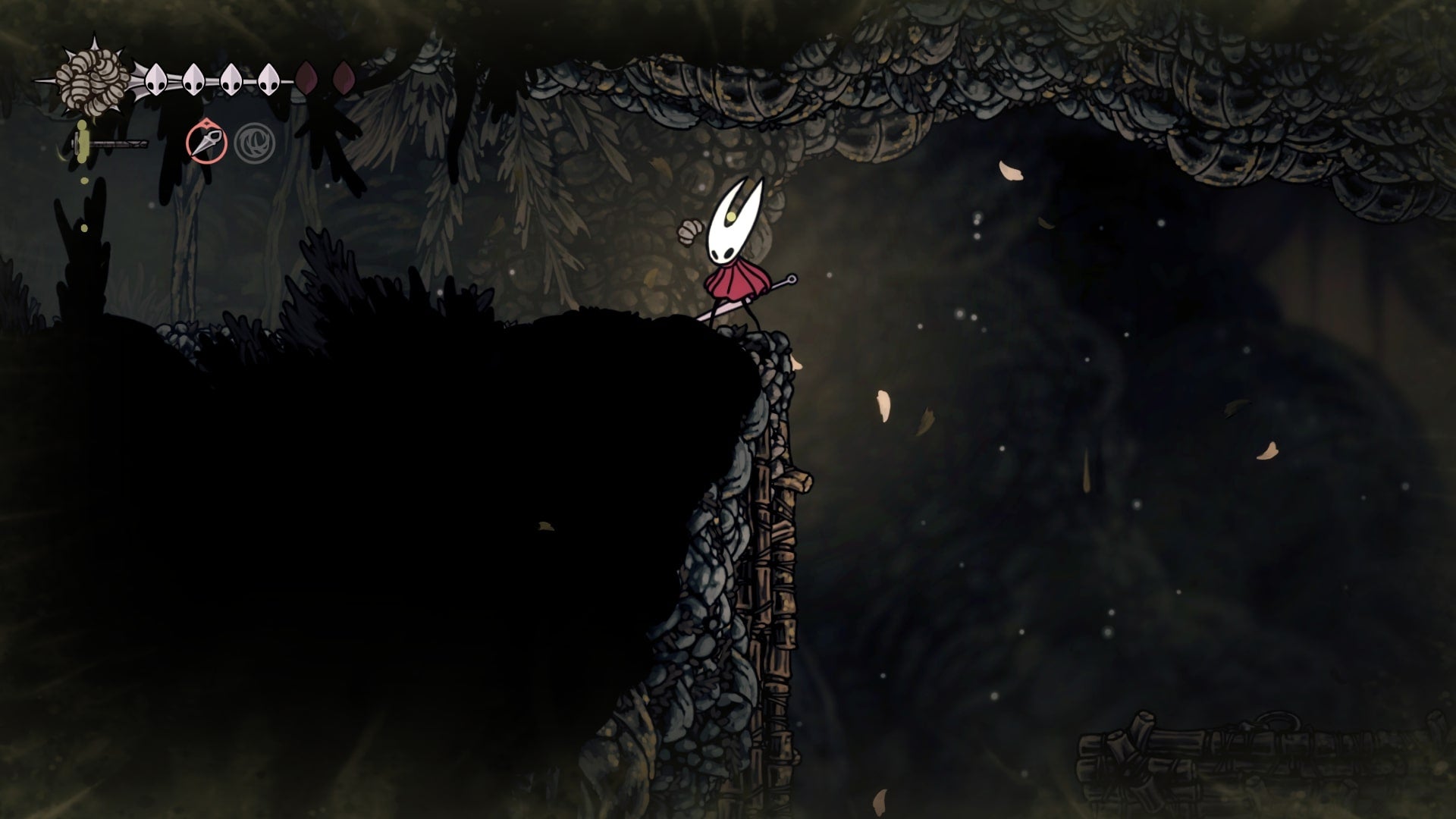 Hornet stands at the edge of a secret passage leading to The Mist in Sinner's Road in Hollow Knight: Silksong