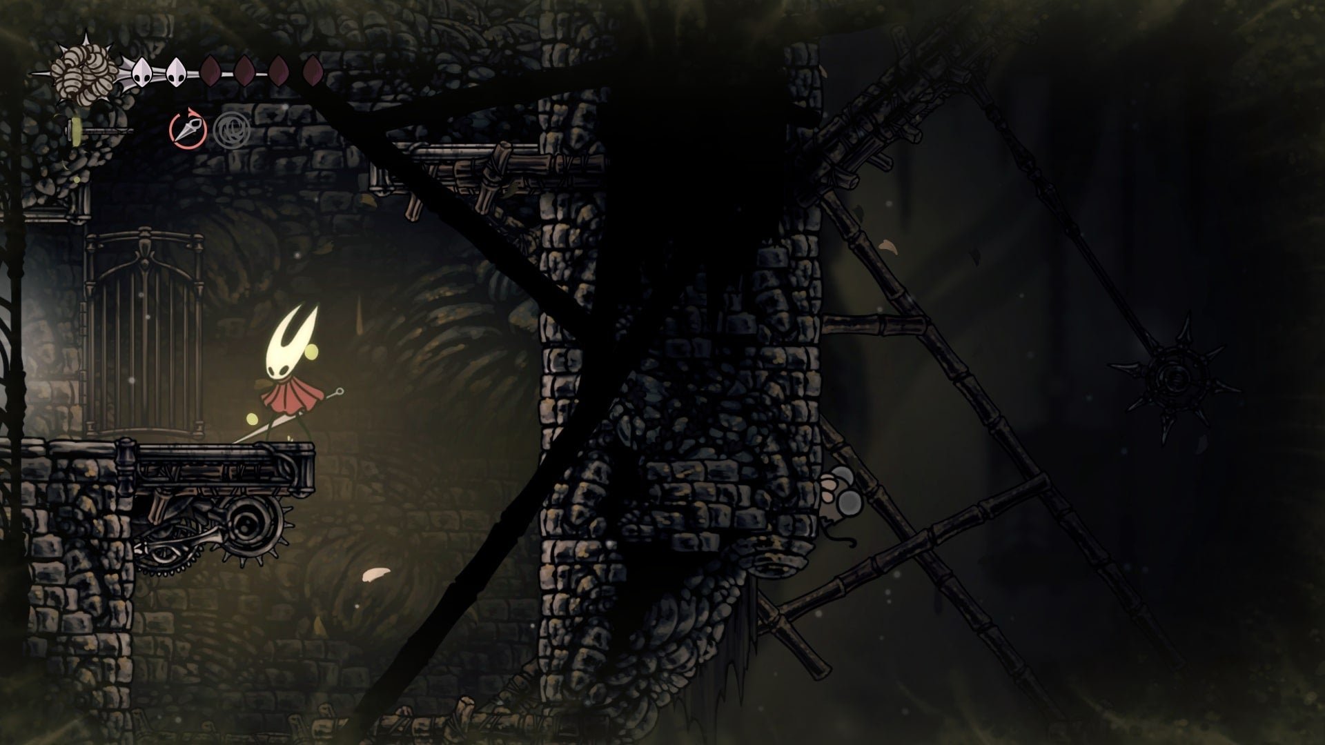 Hornet stands beside a room exit in Sinner's Road in Hollow Knight: Silksong