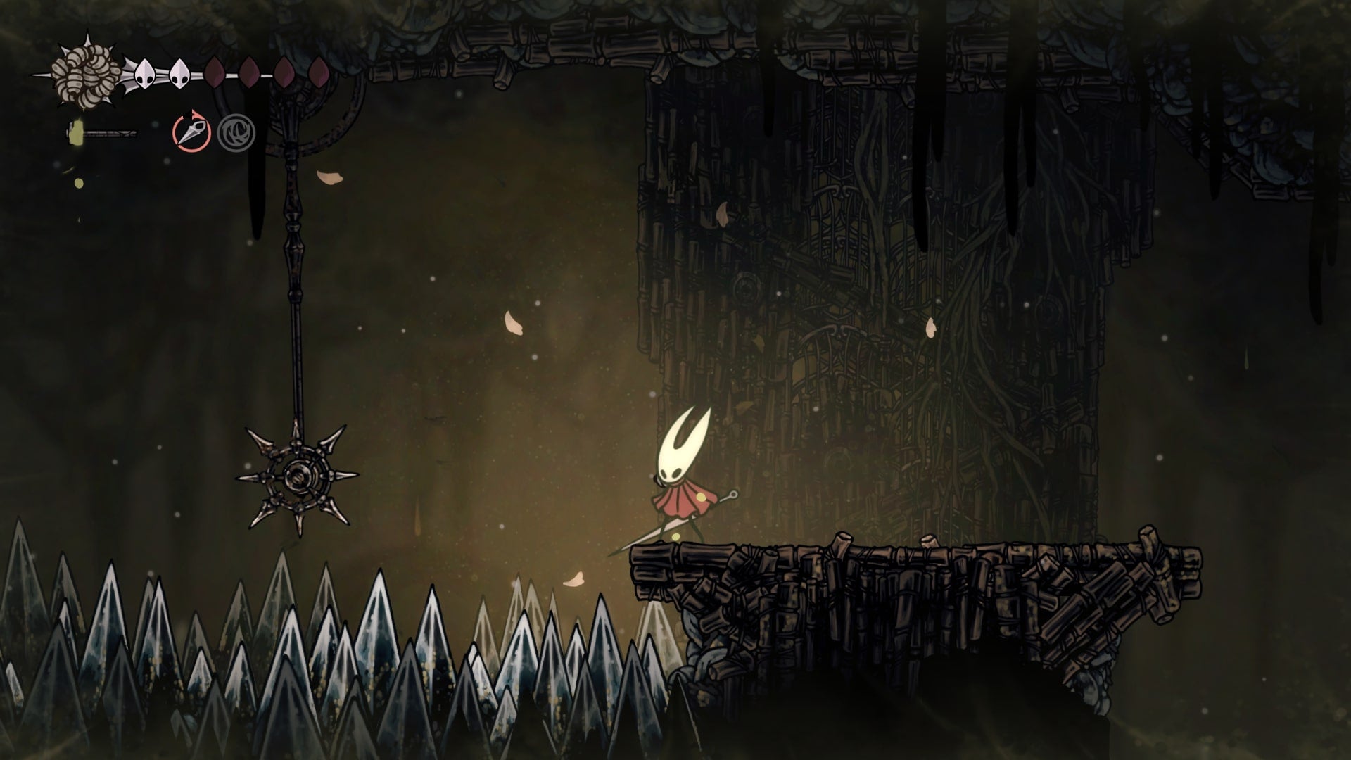 Hornet stands on a platform beside some swinging spike traps in Sinner's Road in Hollow Knight: Silksong