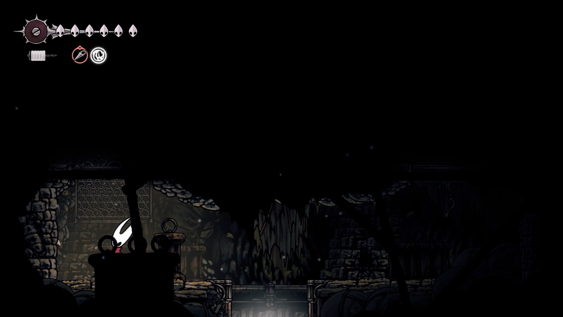 Hornet stands in a tiny room beneath a lever in Sinner's Road in Hollow Knight: Silksong