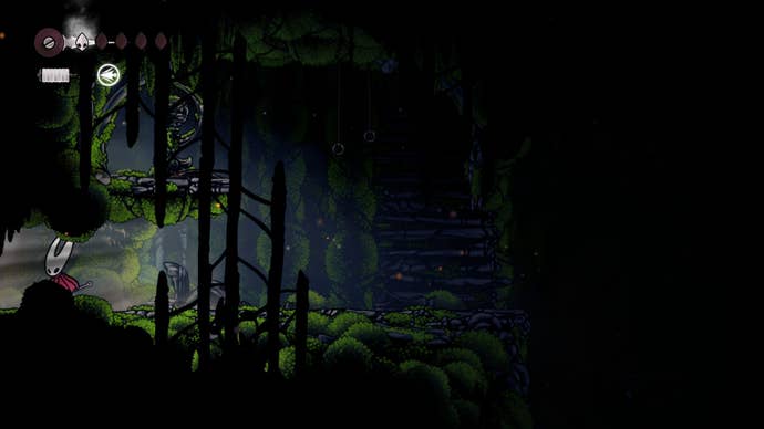 Hornet stands in a secret passage in Mosshome in Hollow Knight: Silksong