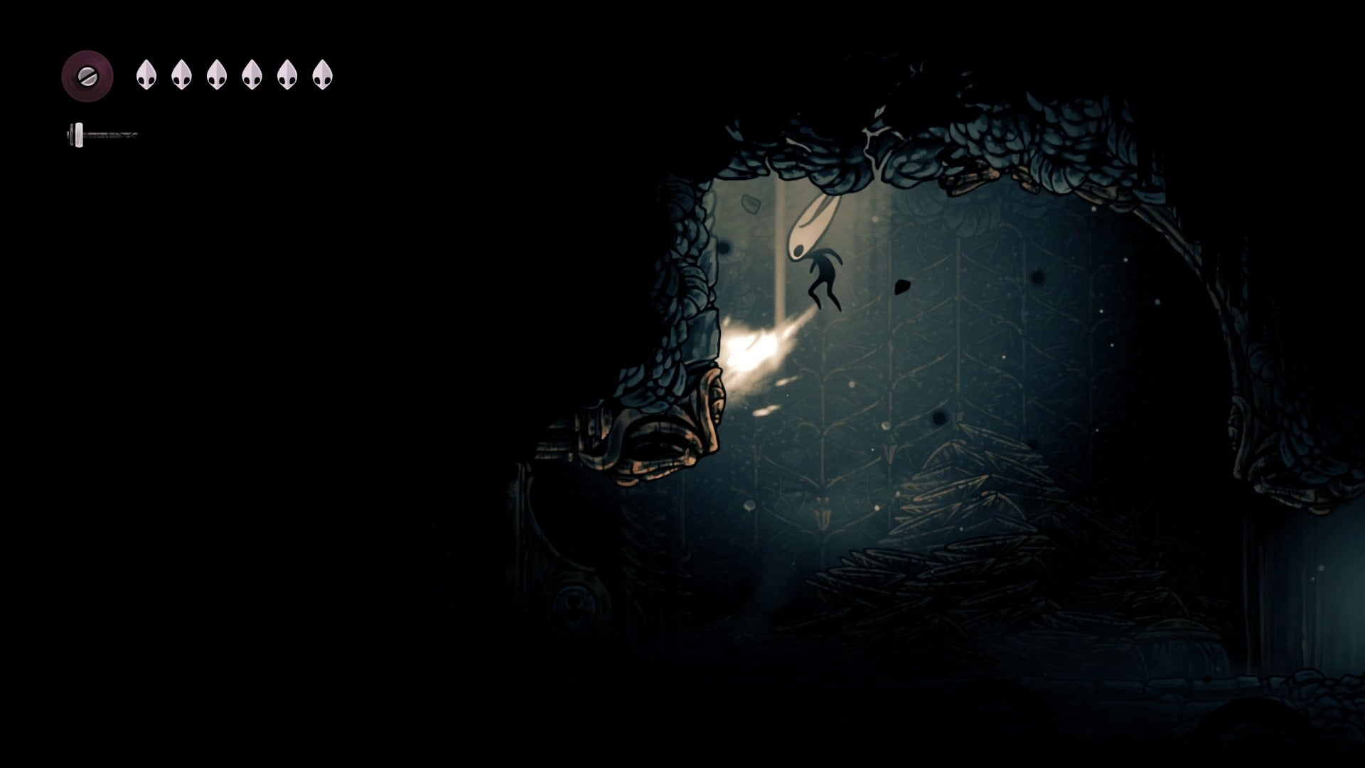 Hornet attacks a breakable ceiling in The Slab in Hollow Knight: Silksong