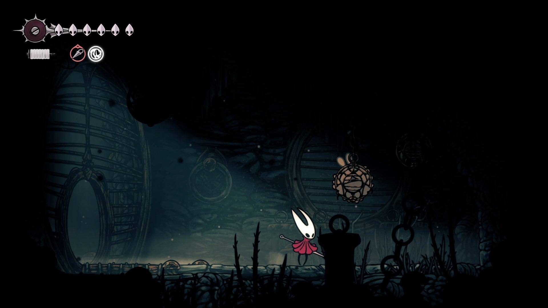 Hornet rescues a Flea in The Slab in Hollow Knight: Silksong