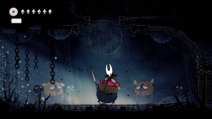 Hornet breaks the neck of her captor in The Slab in Hollow Knight: Silksong