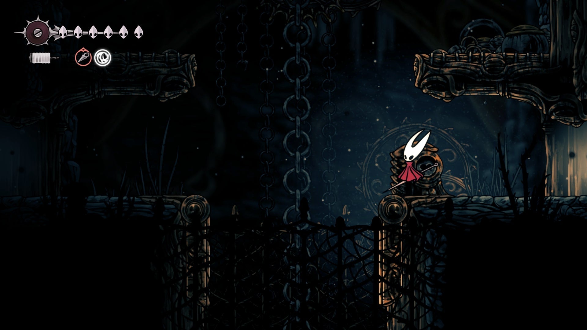 Hornet uses the Key of Heretic on a trapdoor in The Slab in Hollow Knight: Silksong