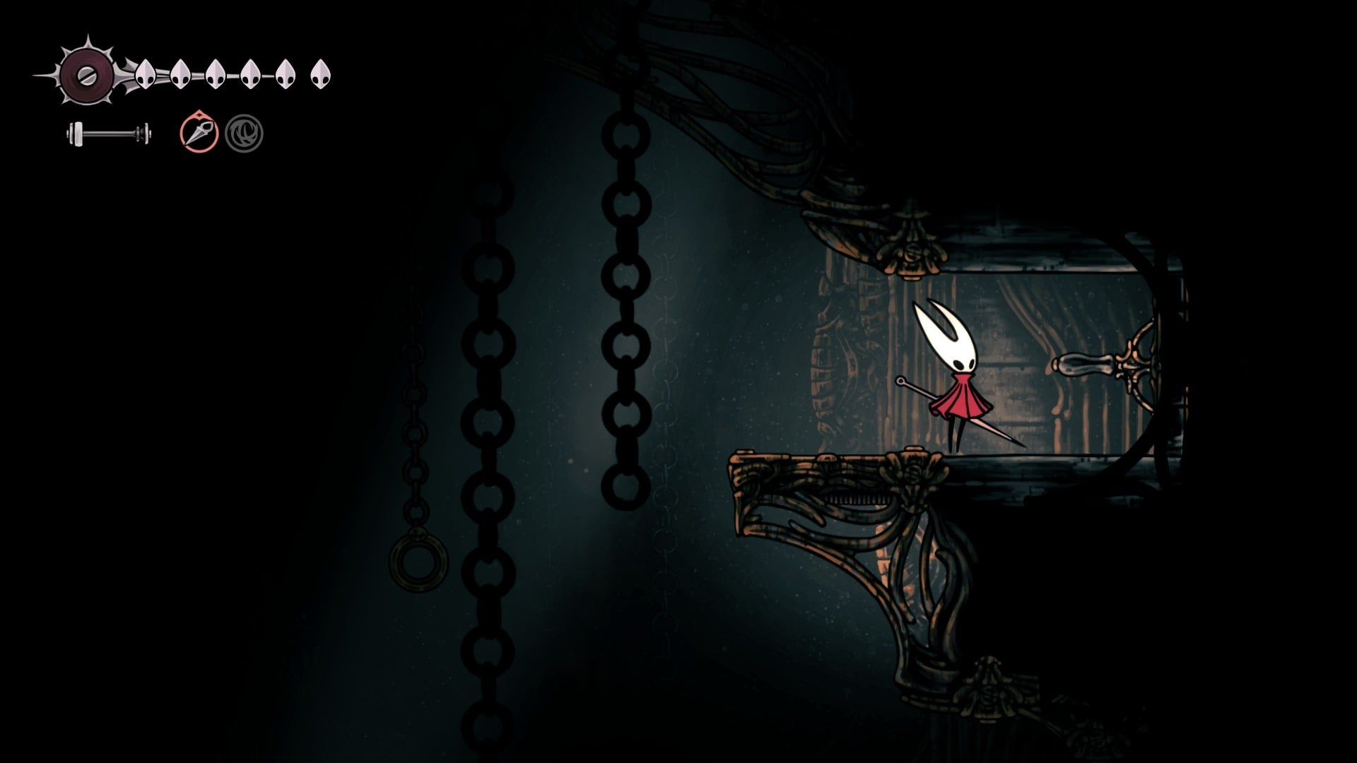 Hornet stands beside an entrance to the Twelfth Architect's room in the Underworks in Hollow Knight: Silksong