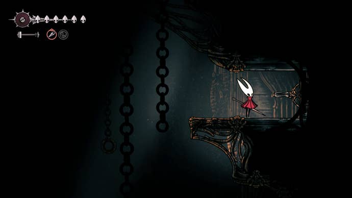 Hornet stands beside an entrance to the Twelfth Architect's room in the Underworks in Hollow Knight: Silksong