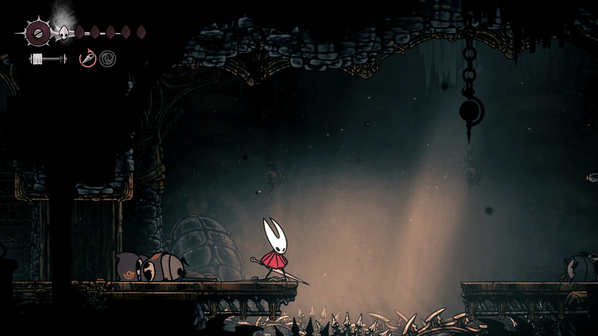 Hornet stands in a gauntlet room - after the gauntlet has ended - in the Underworks in Hollow Knight: Silksong