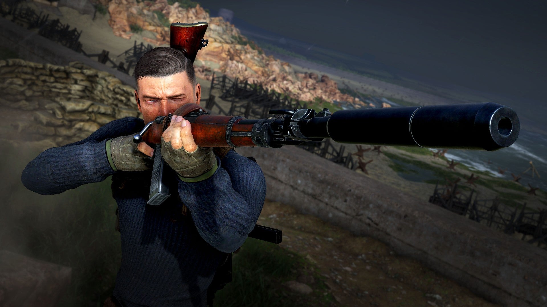 Sniper Elite&rsquo;s Karl Fairburne aims with a suppressed rifle