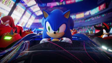Sonic Racing: CrossWorlds trailer screenshot showing Sonic in a car raising his eyebrow