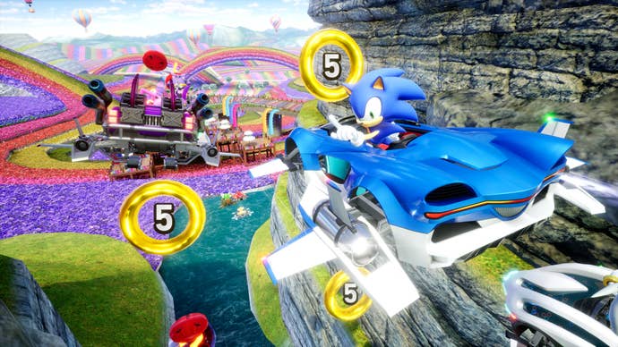 Sonic Racing: CrossWorlds screenshot showing Sonic the blue hedgehog in a blue car gliding through the air