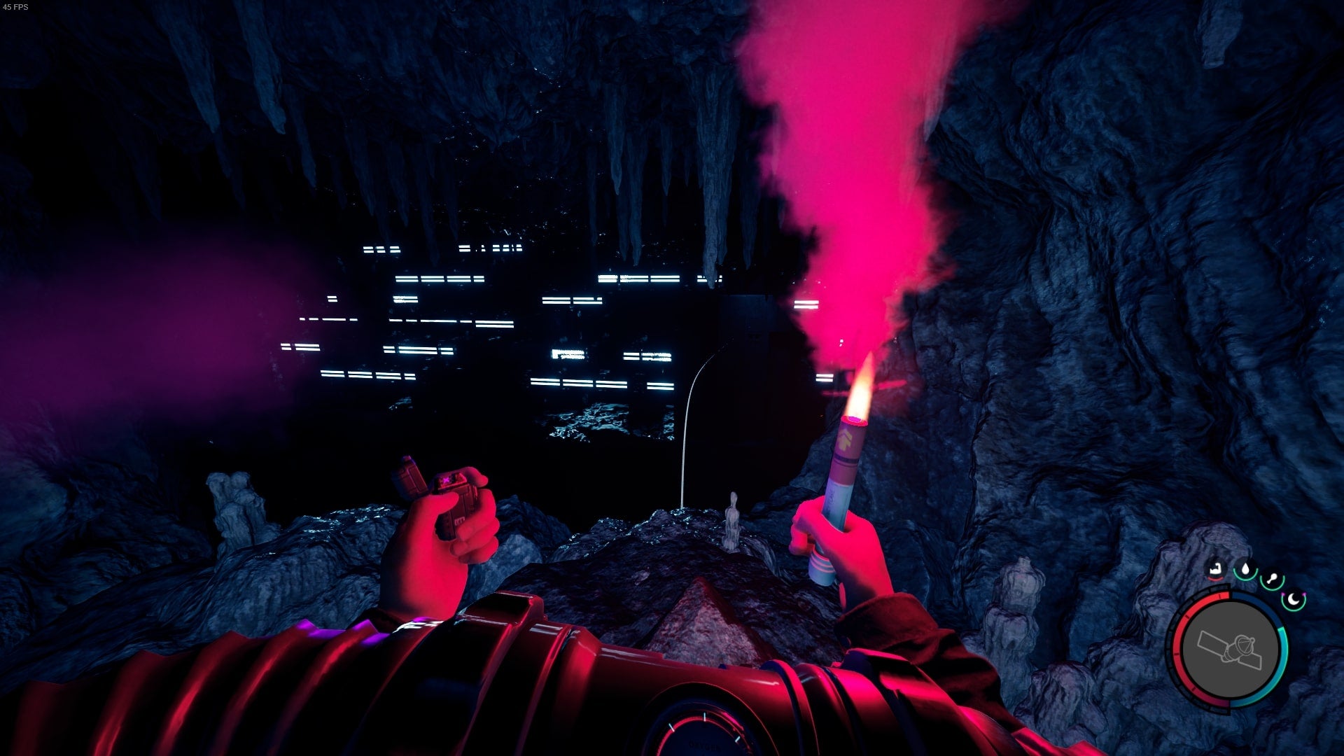 The player looks out at a building in the opening of a cave while holding a flare in Sons of the Forest