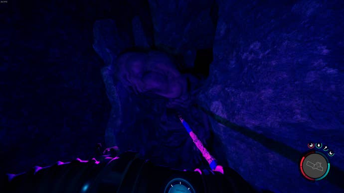 The player looks at a mutant blocking a cave in Sons of the Forest