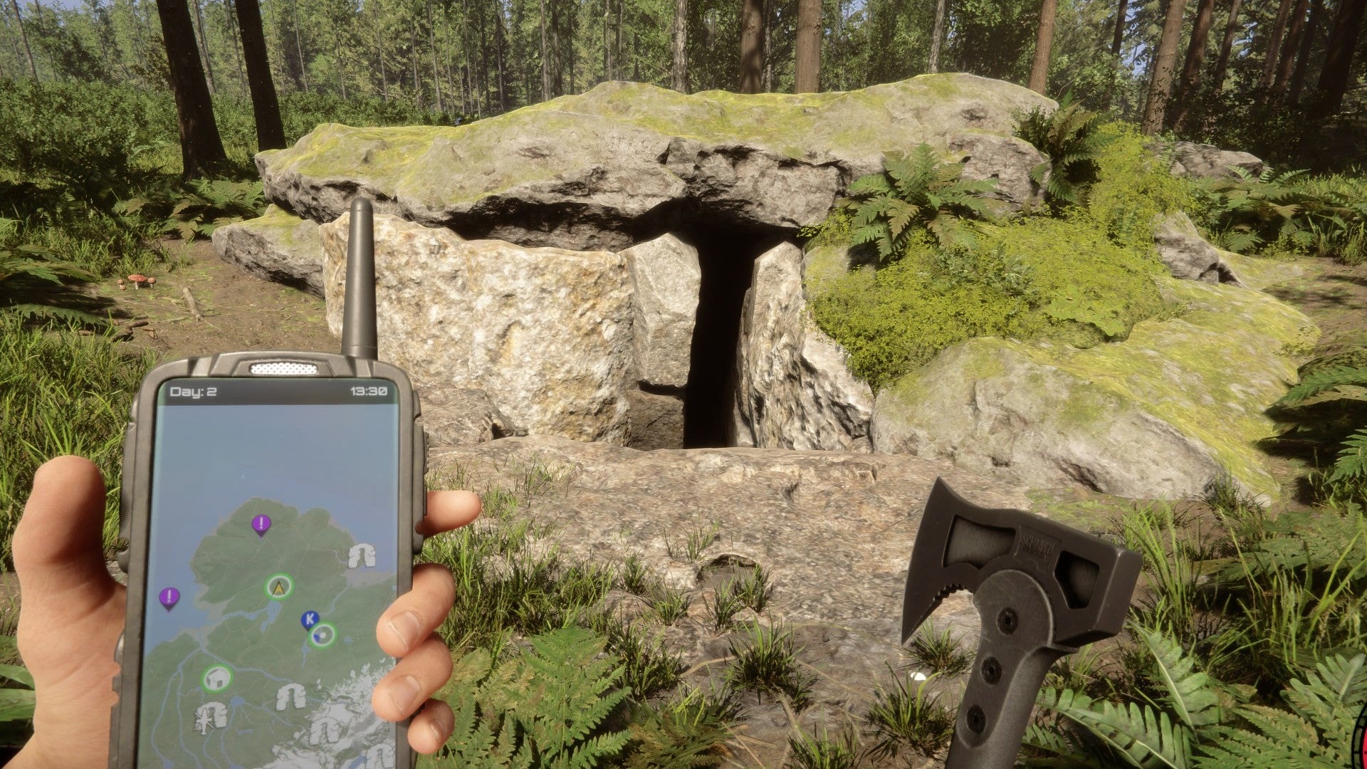 A player stares at a cave entrance while holding a GPS and an axe in Sons of the Forest. - 5