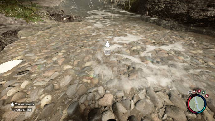 The player drinks water from a river in Sons of the Forest