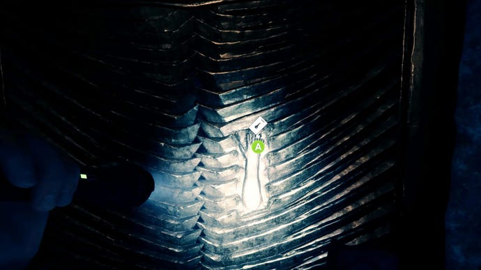 A player stares at the hand print in a golden door in Sons Of The Forest.