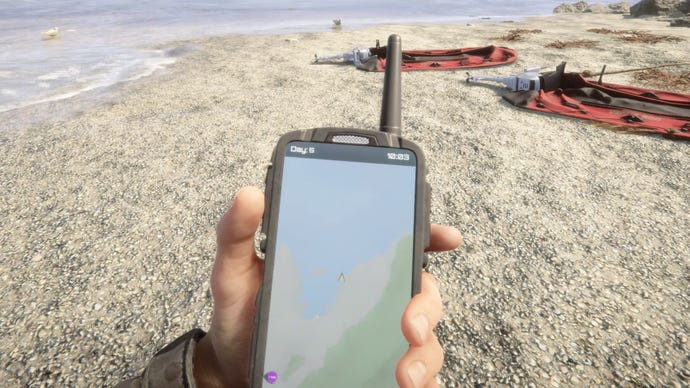 A player holds their GPS on the beach in Sons Of The Forest.