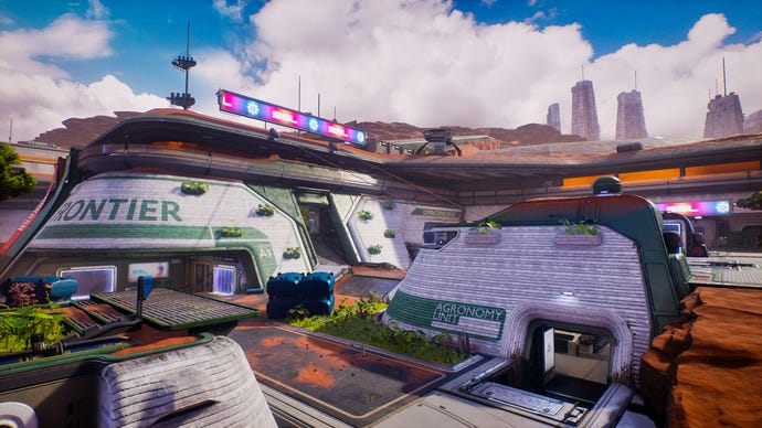 A view of a huge sports arena in Splitgate 2, with a blue sky and sleek futuristic architecture