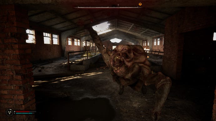 A Flesh mutant attacks inside a cowshed in STALKER 2: Heart of Chornobyl.