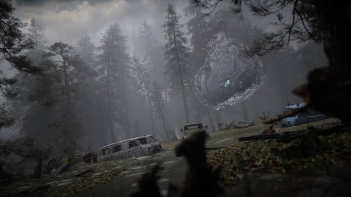 The player is crouched beside a large bubble anomaly in Stalker 2