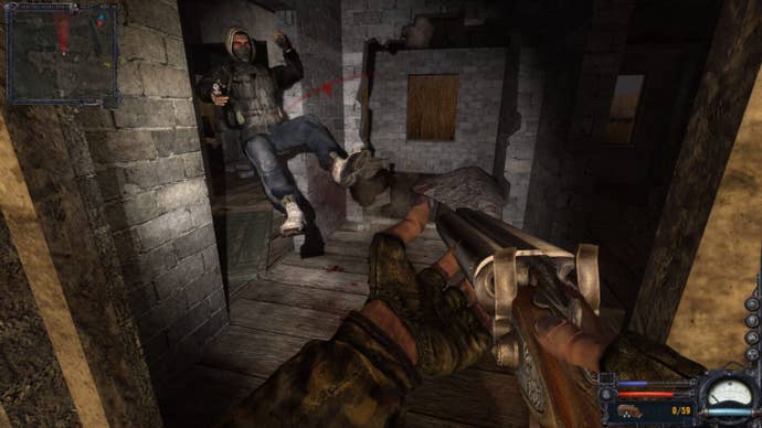 A survivor is knocked backwards from a shot from the player’s shotgun in Stalker: Clear Sky.