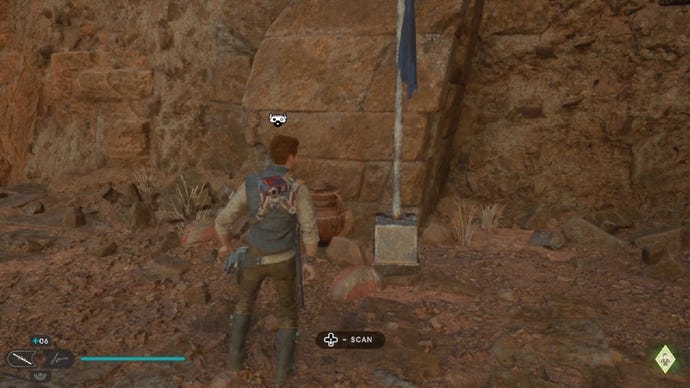 Star Wars Jedi Survivor screenshot showing Cal staring at a scan point next to a flag.