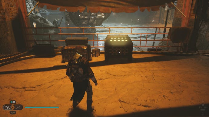 Star Wars Jedi Survivor screenshot showing Cal near a chest in the hangar of Cere’s Base.