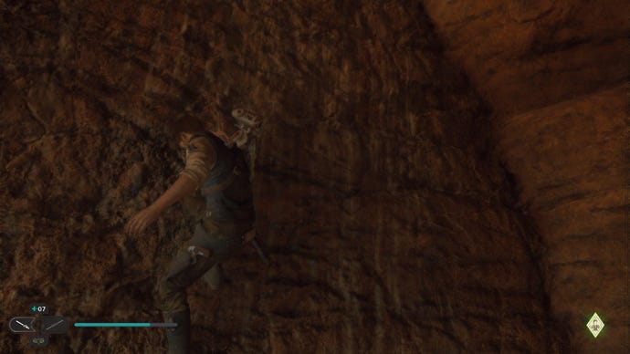 Star Wars Jedi Survivor screenshot showing Cal holding onto a wall in a shaded alcove.