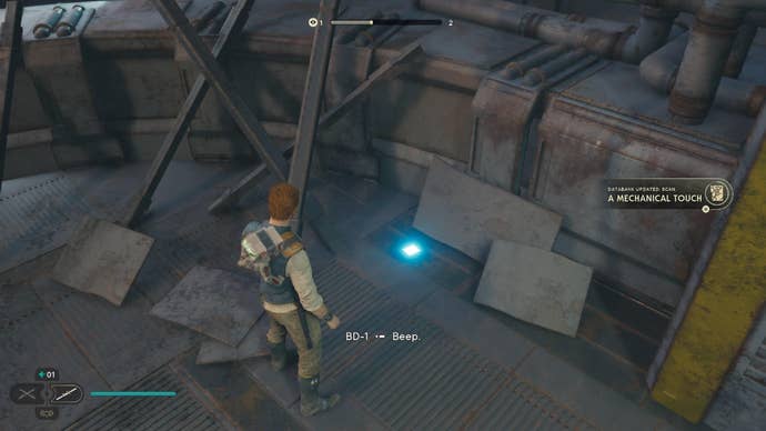 Star Wars Jedi Survivor screenshot showing Cal stood near a scannable device on the floor.