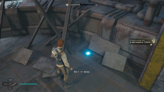 Star Wars Jedi Survivor screenshot showing Cal stood near a scannable device on the floor.