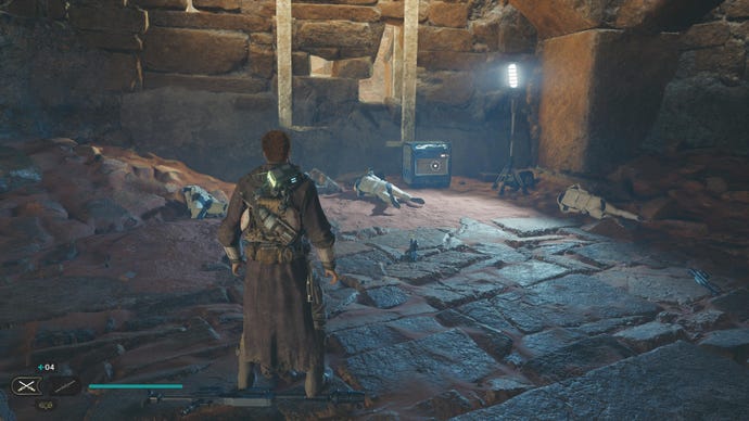 Star Wars Jedi Survivor screenshot showing Cal Kestis in a dimly lit ruin staring at a chest.