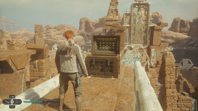 Star Wars Jedi Survivor screenshot showing Cal stood near a chest on a sandy ledge.