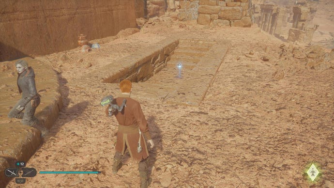 Star Wars Jedi Survivor screenshot showing Cal staring into a tomb atop some desert ruins. There’s an essence glowing in the tomb.