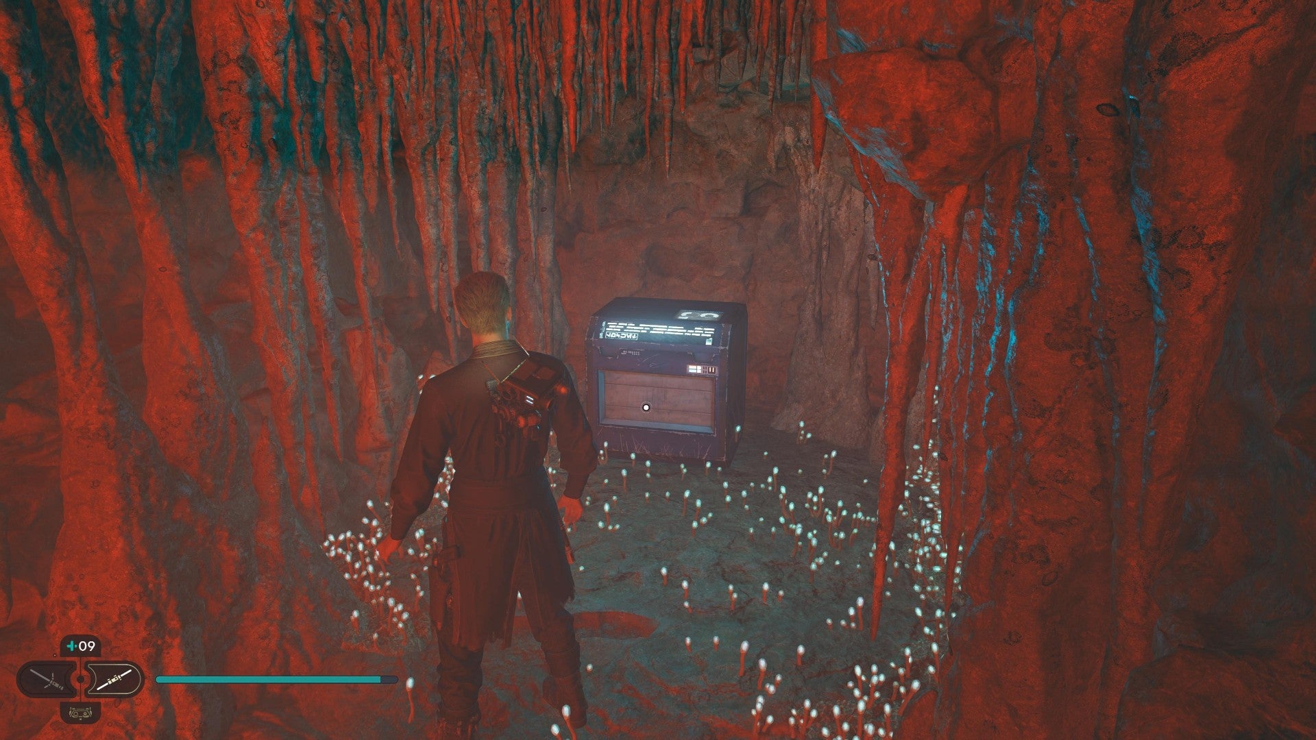 Star Wars Jedi Survivor screenshot showing Cal stood near a chest in a tight cavern.