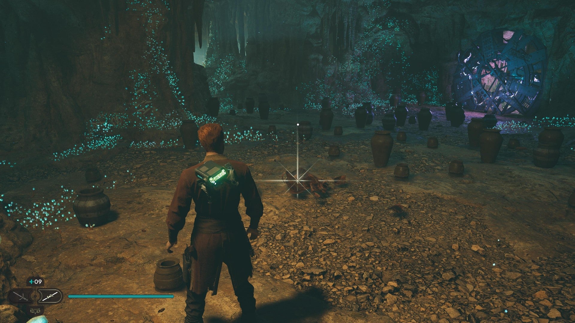 Star Wars Jedi Survivor screenshot showing Cal stood near a glistening Datadisc in a dark cave.