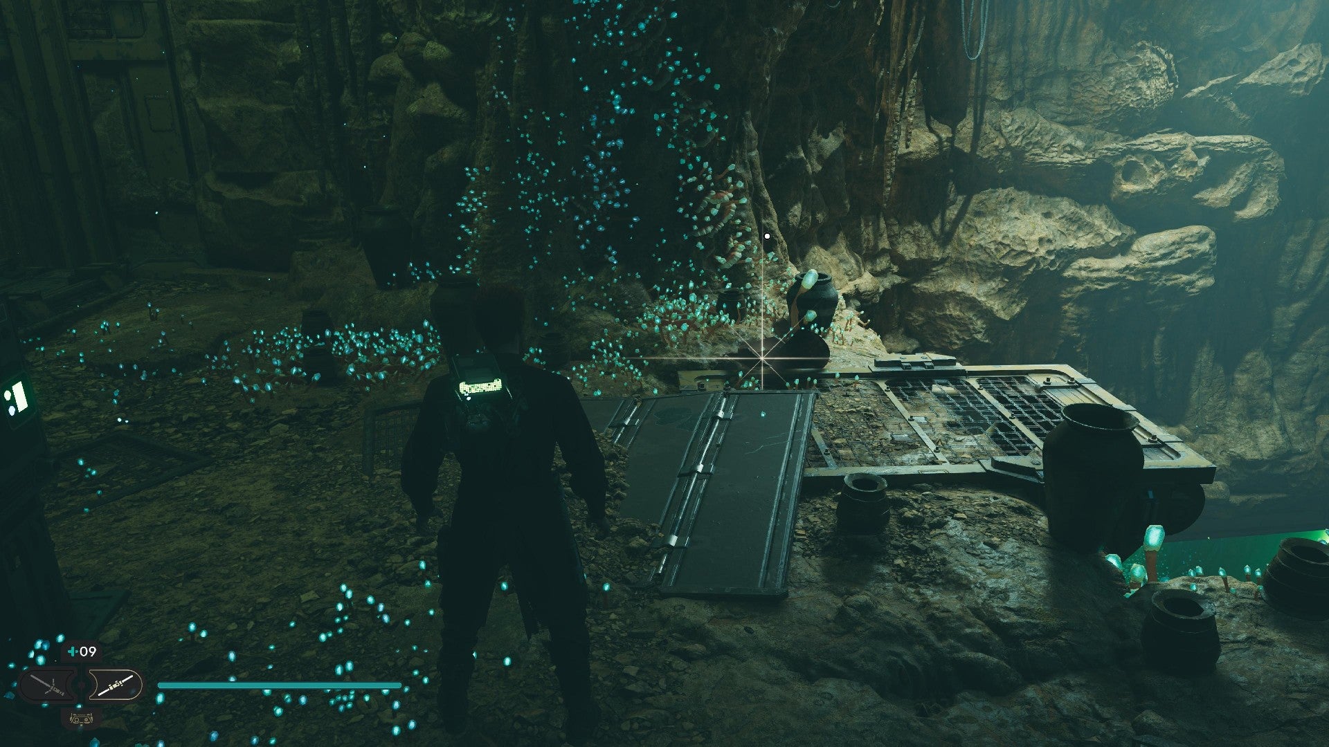 Star Wars Jedi Survivor screenshot showing Cal stood near a glistening Datadisc in a dark cave.