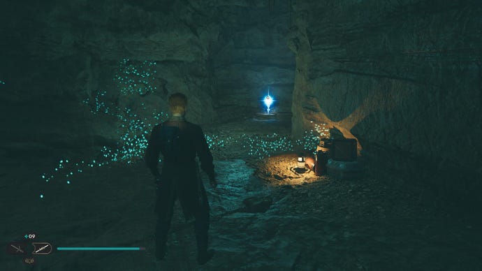 Star Wars Jedi Survivor screenshot showing Cal near a glistening Skill Point Essence in a dark cavern.